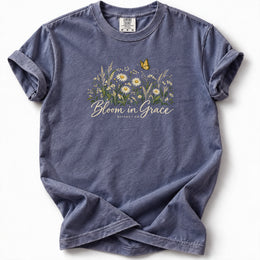 Bloom in Grace Premium T-Shirt in Denim, front view with wildflowers and butterfly artwork