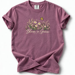 Bloom in Grace Premium T-Shirt in Berry, front view with wildflowers and butterfly artwork
