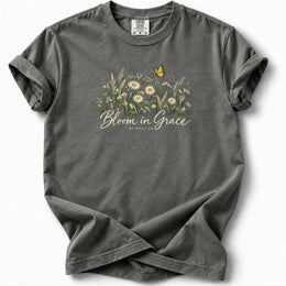 Bloom in Grace Premium T-Shirt in Pepper, front view with wildflowers and butterfly artwork