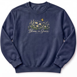 Bloom in Grace Premium Sweatshirt in True Navy, front view with wildflowers and butterfly artwork