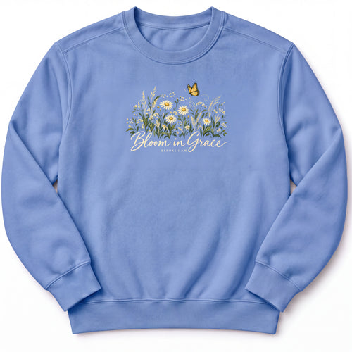 Bloom in Grace Premium Sweatshirt in Flo Blue, front view with wildflowers and butterfly artwork