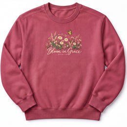 Bloom in Grace Premium Sweatshirt in Crimson, front view with wildflowers and butterfly artwork