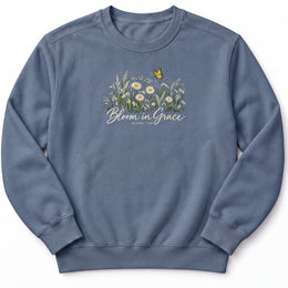 Bloom in Grace Premium Sweatshirt in Blue Jean, front view with wildflowers and butterfly artwork