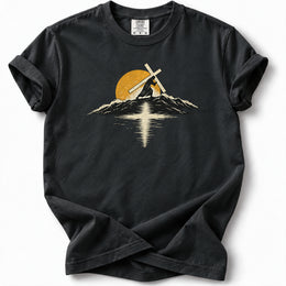 Carry the Light Premium T-Shirt in Black, front view with cross-bearing silhouette, mountains and sun