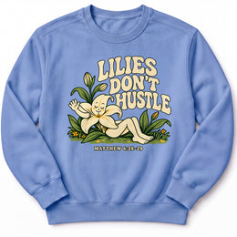 Lilies Don’t Hustle Premium Sweatshirt in Flo Blue, front view with botanical character inspired by Matthew 6:28–29