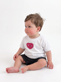 Pure of Heart Baby T-Shirt in White, Liam left three quarter view