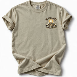 Your Light Has Come Edition T-Shirt in Sandstone – left chest Isaiah 60:1 design